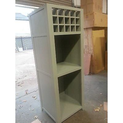 Free standing oven housing unit with cupboard and wine rack